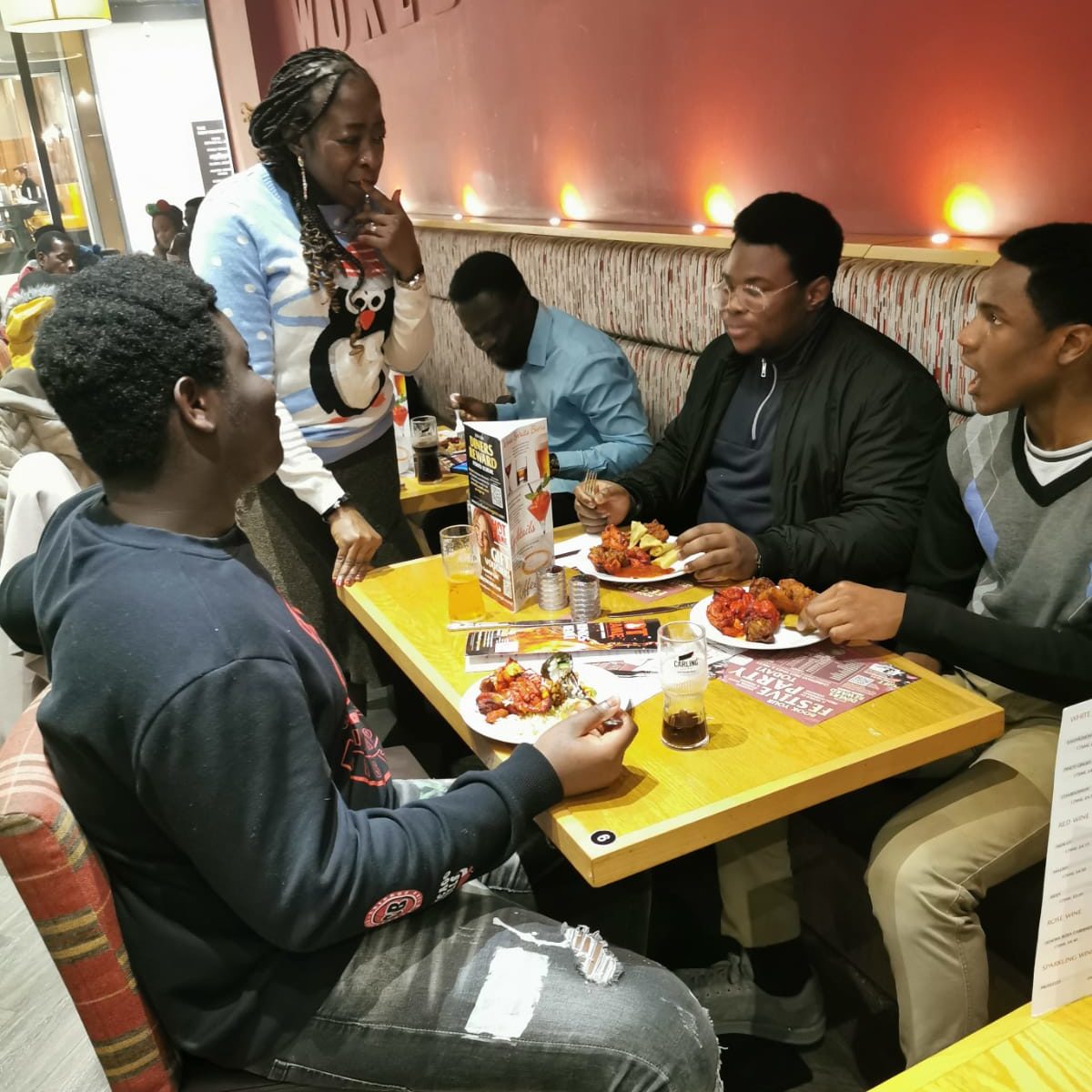 Lighthouse teenagers having Christmas dinner